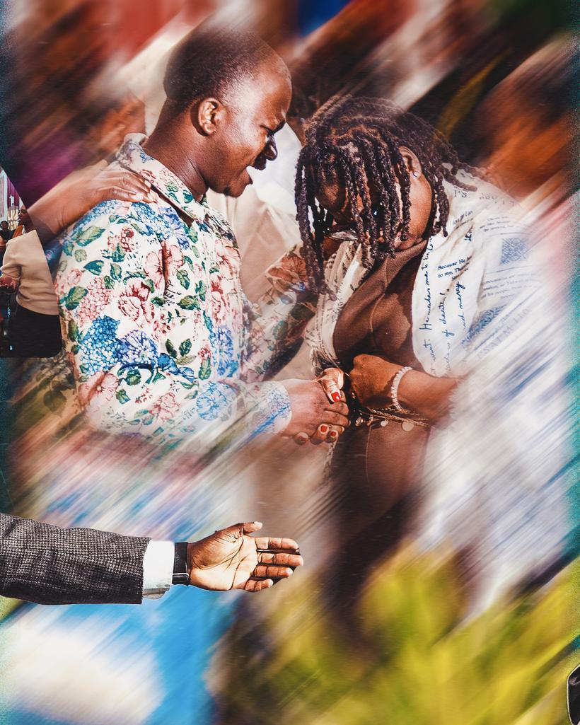 Two believers praying together at the altar